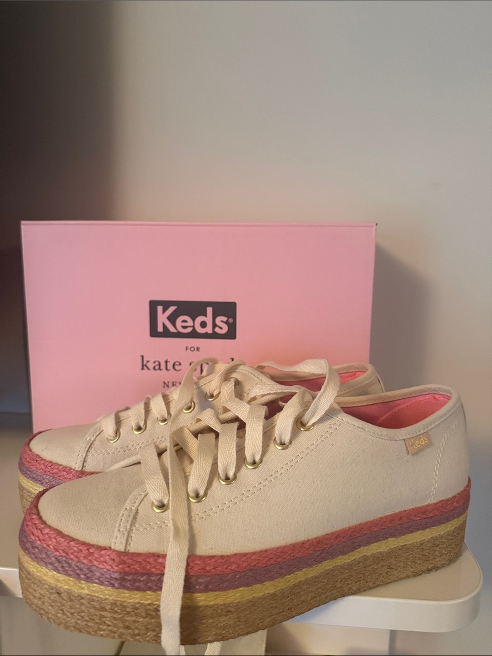kate spade cream canvas platform sneakers with pink and gold accents